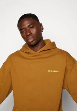 HOODIE BERLIN UNISEX - Kapuzenpullover - Brown -Herrenbekleidung 08c1e22fac8841268cc4dd0ba361a17e