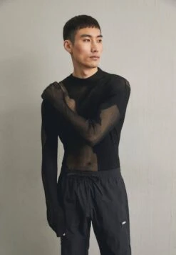 032c TRANSPARENT TURTLENECK - Strickpullover - Black
